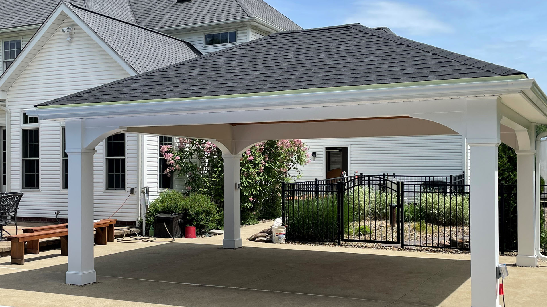 Covered outdoor pavilion attached to a home by Stellar Construction