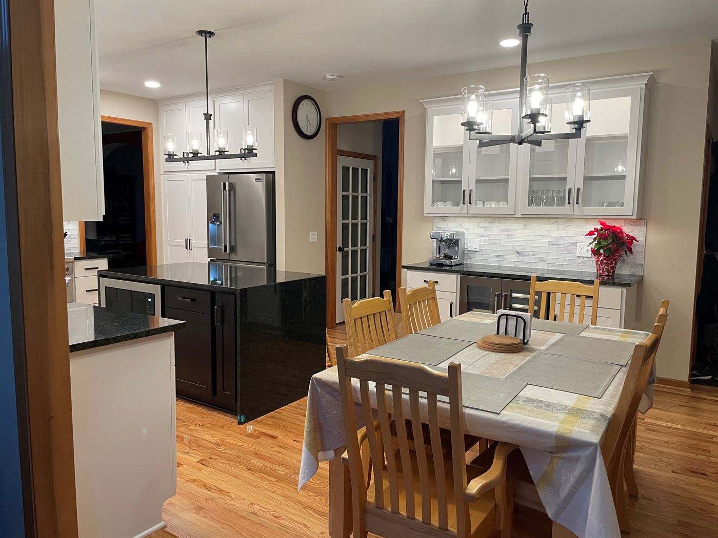 Kitchen island and glass-front cabinetry by Stellar Construction